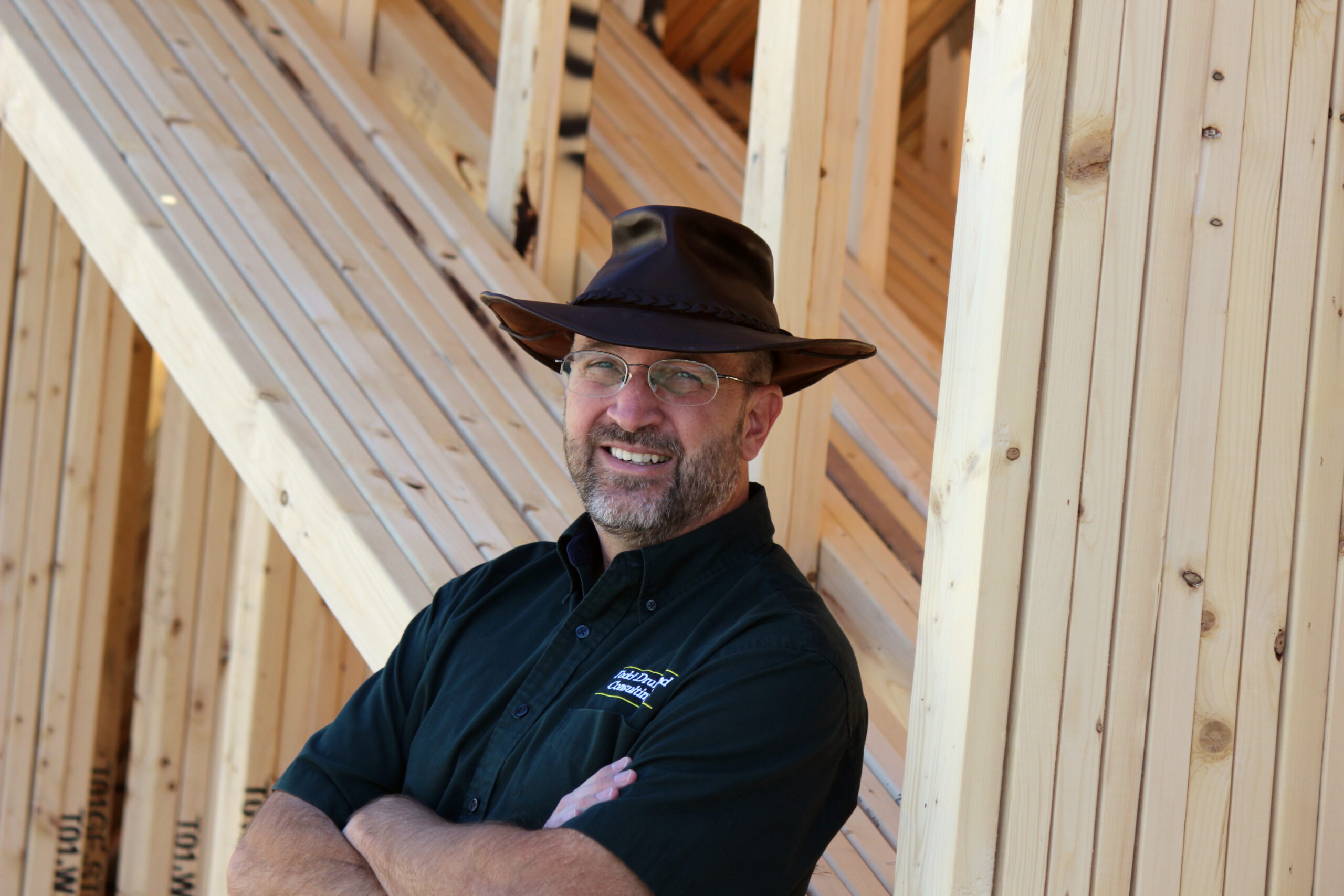 Todd Drummond, manufacturing operations consultant, in a wood-framed building